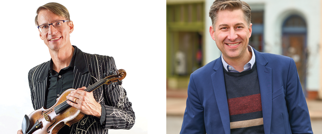 Man holding violin and man smiling