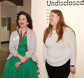 Two women laughing together