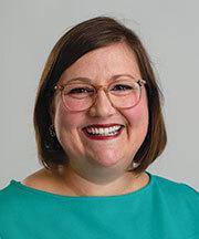 Woman with glasses smiling