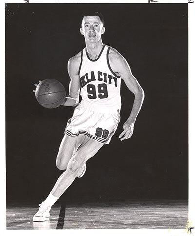 Man in basketball uniform holding basketball